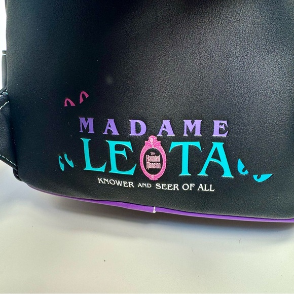 NWT. Loungefly Disney\'s The Haunted Mansion Madame Leota Mini Backpack glows main image 15